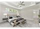 Well-lit main bedroom with tray ceiling, recessed lighting, and multiple windows, creating a bright and airy atmosphere at 1645 Carolina Cir, Gastonia, NC 28054