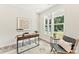 Well-lit home office with a modern desk, chair, and large window overlooking the outdoors at 1645 Carolina Cir, Gastonia, NC 28054