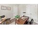 Cozy home office with a wood desk, comfortable chair, and a bright window view at 1645 Carolina Cir, Gastonia, NC 28054