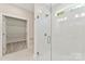 Modern shower features glass enclosure, a window, and recessed lighting, creating a spa-like experience at 1645 Carolina Cir, Gastonia, NC 28054