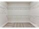 Spacious walk-in closet with ample shelving, providing plenty of storage for an organized wardrobe at 1645 Carolina Cir, Gastonia, NC 28054