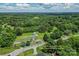 Aerial view of the property showing the home and surrounding area, lot line outlined at 1730 Woodbend Ln, Conover, NC 28613