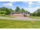 Charming single-story home with light siding, manicured lawn, and inviting curb appeal on a sunny day at 1730 Woodbend Ln, Conover, NC 28613