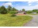 Inviting single-story home with manicured lawn, complemented by lush greenery and a serene neighborhood setting at 1730 Woodbend Ln, Conover, NC 28613