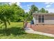 Ramp leads to the side entrance of this single story home with vinyl siding and mature landscaping at 1730 Woodbend Ln, Conover, NC 28613