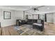 Inviting living room with comfortable seating, wood floors, neutral tones, and abundant natural light at 1730 Woodbend Ln, Conover, NC 28613