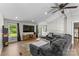 Bright living room featuring a large sectional sofa, wood floors, recessed lighting, and a ceiling fan at 1730 Woodbend Ln, Conover, NC 28613