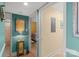 Inviting hallway with decorative accents leading to a bedroom with warm yellow walls at 20417 Harborgate Ct # 510, Cornelius, NC 28031