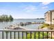Picturesque lake view showcasing docks and boats under a clear blue sky from a lovely home at 20417 Harborgate Ct # 510, Cornelius, NC 28031