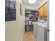 Laundry room with washer, dryer, shelving, and storage, offering convenience and organization at 20417 Harborgate Ct # 510, Cornelius, NC 28031