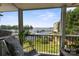 Covered porch with relaxing chair, featuring views of the water and boat docks, perfect for unwinding at 20417 Harborgate Ct # 510, Cornelius, NC 28031
