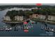 Aerial view featuring the marina, lake, multiple condo buildings, and boat slips at 20417 Harborgate Ct # 510, Cornelius, NC 28031