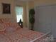 Bedroom featuring patterned bedding, a window, and a closet with a double door at 20417 Harborgate Ct # 510, Cornelius, NC 28031