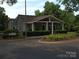 Charming clubhouse featuring a covered porch with columns and beautifully landscaped grounds at 20417 Harborgate Ct # 510, Cornelius, NC 28031