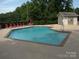 Refreshing community swimming pool with lounge chairs and a nearby restroom facility at 20417 Harborgate Ct # 510, Cornelius, NC 28031