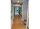 Bright hallway featuring hardwood floors and decorative wall accents at 20417 Harborgate Ct # 510, Cornelius, NC 28031