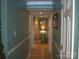 Inviting hallway with hardwood floors and decorative molding at 20417 Harborgate Ct # 510, Cornelius, NC 28031
