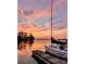 Sailboat docked on tranquil waters at sunset, reflecting vibrant colors and peaceful atmosphere at 20417 Harborgate Ct # 510, Cornelius, NC 28031