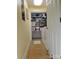 Interior storage closet with shelving, laundry machine, cleaning supplies, and a wooden floor at 20417 Harborgate Ct # 510, Cornelius, NC 28031