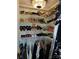 Spacious walk-in closet with chandelier, shoe shelving, hanging racks, and ample storage at 20417 Harborgate Ct # 510, Cornelius, NC 28031