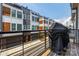 Balcony view of modern townhome complex with gray exterior and rooftop terraces at 2108 Bryant Park Dr, Charlotte, NC 28208