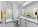 Clean bathroom with neutral countertops, bright lighting, and a glass shower at 2108 Bryant Park Dr, Charlotte, NC 28208