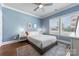 Cozy bedroom featuring a comfortable bed, stylish decor, and a ceiling fan at 2108 Bryant Park Dr, Charlotte, NC 28208