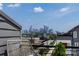 Enjoy stunning city skyline views from this modern home's terrace with seating and skyline at 2108 Bryant Park Dr, Charlotte, NC 28208