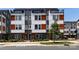 Modern townhome showcasing a contemporary design with mixed material facade at 2108 Bryant Park Dr, Charlotte, NC 28208