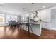 Open concept kitchen and dining area featuring stainless appliances and a breakfast bar at 2108 Bryant Park Dr, Charlotte, NC 28208