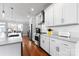 Open-concept kitchen featuring stainless appliances, white cabinets, and subway tile backsplash at 2108 Bryant Park Dr, Charlotte, NC 28208