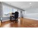 Bright office space with hardwood floors, large windows, and a door to the outside at 2108 Bryant Park Dr, Charlotte, NC 28208
