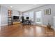 Bright office space with hardwood floors, large windows, and a door to the outside at 2108 Bryant Park Dr, Charlotte, NC 28208