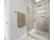A glass enclosed shower with tile surround features modern fixtures and a built-in niche at 2108 Bryant Park Dr, Charlotte, NC 28208