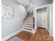 Modern staircase with hardwood floors and elegant railing at 2108 Bryant Park Dr, Charlotte, NC 28208