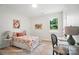 Cheerful bedroom with floral bedding, a study desk, neutral carpet, and a view of the outdoors at 2116A Glenwood St, Kannapolis, NC 28083