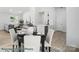 Open-concept dining area with seating for four, view of the living room, and seamless access to the kitchen at 2116A Glenwood St, Kannapolis, NC 28083