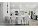 Modern kitchen with white cabinets, stainless steel appliances, and a center island with bar seating at 2116A Glenwood St, Kannapolis, NC 28083