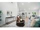 Bright living room featuring neutral tones, a vaulted ceiling, and an open concept design to the kitchen and dining room at 2116A Glenwood St, Kannapolis, NC 28083