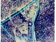 Aerial view showcasing the property lines of the land and house in its natural, wooded setting at 2130 Vashti Rd, Taylorsville, NC 28681
