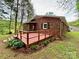 Charming backyard brick home features a spacious deck perfect for outdoor entertaining and relaxation at 2130 Vashti Rd, Taylorsville, NC 28681