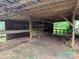 Barn interior showcasing wooden framework, stalls and ample storage, ready for customization and use at 2130 Vashti Rd, Taylorsville, NC 28681