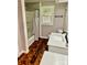 A bathroom featuring hardwood floors, a shower, a sink, and a window at 2130 Vashti Rd, Taylorsville, NC 28681