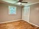 A bedroom featuring hardwood floors, ceiling fan, a window, and closet at 2130 Vashti Rd, Taylorsville, NC 28681