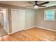 A bedroom featuring hardwood floors, a ceiling fan, a window, and closet at 2130 Vashti Rd, Taylorsville, NC 28681