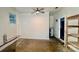 Bonus room featuring empty shelving, ceiling fan, and water heater at 2130 Vashti Rd, Taylorsville, NC 28681