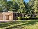 Charming brick home featuring a well-manicured lawn and beautiful landscaping at 2130 Vashti Rd, Taylorsville, NC 28681
