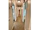 Long hallway showcasing multiple doorways and access to various rooms in the home at 2130 Vashti Rd, Taylorsville, NC 28681