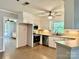 Open kitchen with a view into the living room featuring an oven and stainless steel dishwasher at 2130 Vashti Rd, Taylorsville, NC 28681