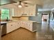 Well-designed kitchen with white cabinets and a view to the living spaces at 2130 Vashti Rd, Taylorsville, NC 28681